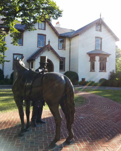Bronze full-size statue of President Abraham Lincoln outside the Soldiers' Home summer cottage where he and his family stayed, 1861-1864.